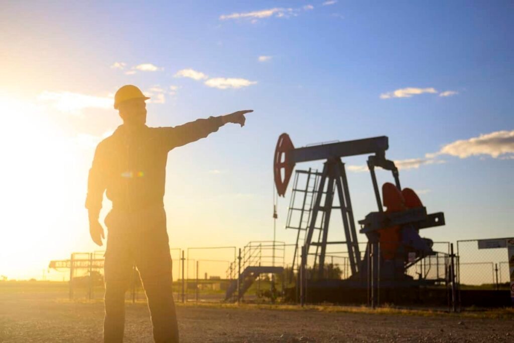 Oil industry worker works in oilfield